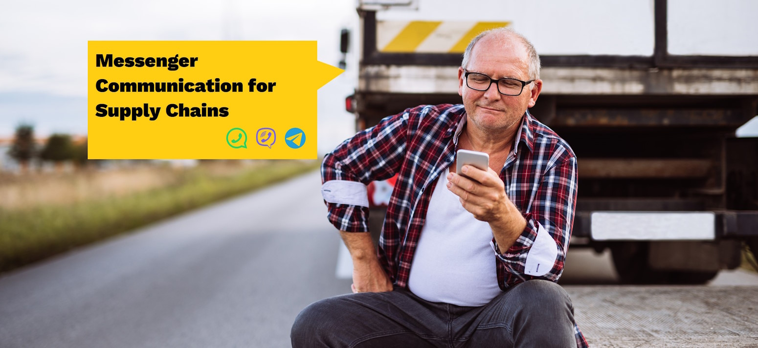 Trucker looks satisfied at his smartphone